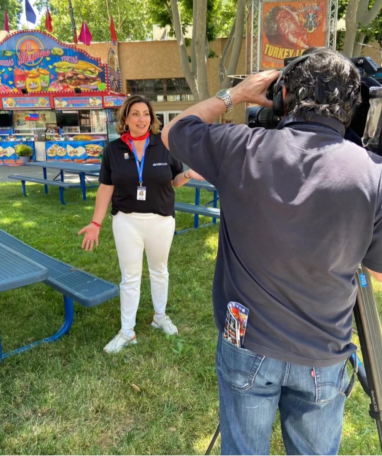Kim Bardakian giving a TV interview at the Alameda County Fair