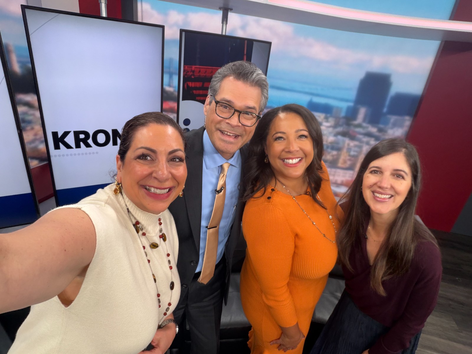 Kim Bardakian on set at KRON 4 with the news team